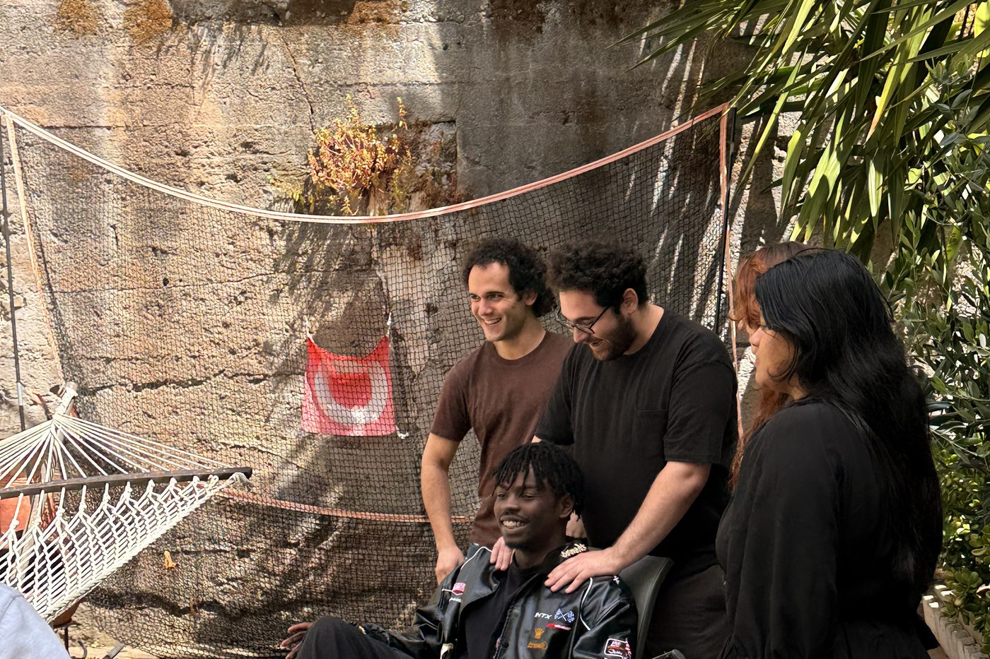 Members talking in the backyard of the Hacker House.